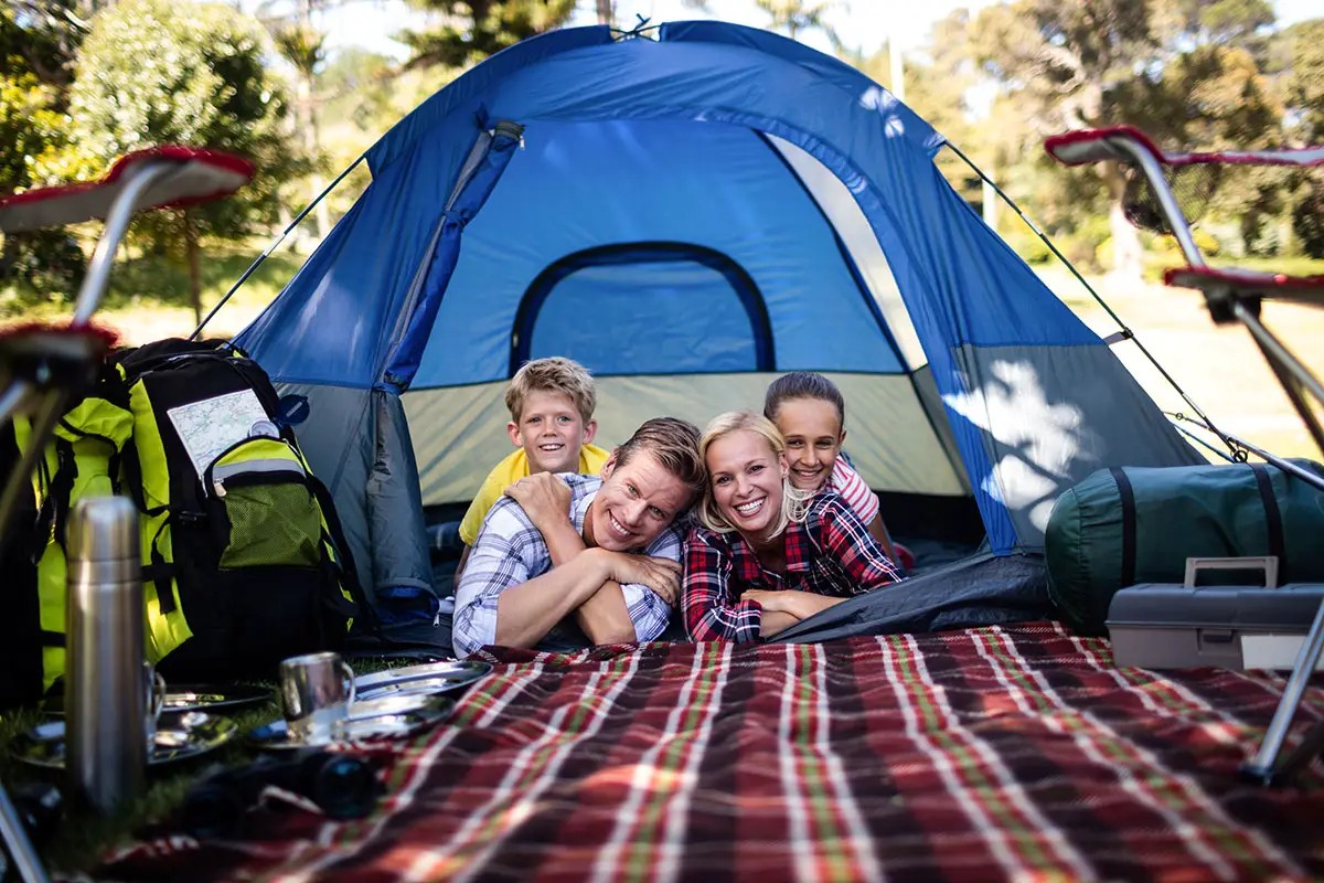 Family camping in a tent.